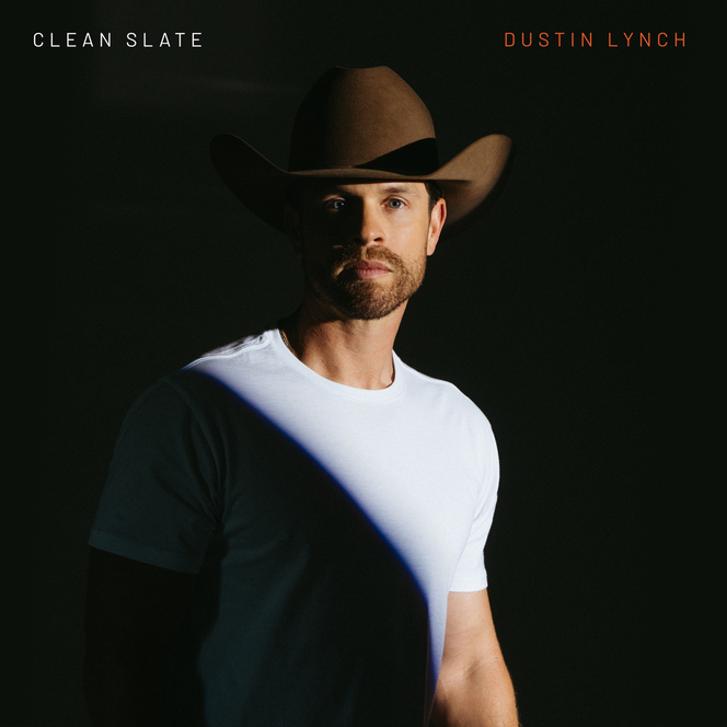Dustin Lynch in a cowboy hat on the Clean Slate album cover